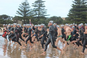 Running into water for Danger 1000 Ocean Swim